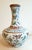 Chinese Porcelain butterfly changjingping, a finely formed, long necked vase with a gold glazed lip, and a white glazed...