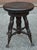 A the late 19th/early 20th century piano stoll featuring a circular wooden seat that spins to adjust height. Features four...