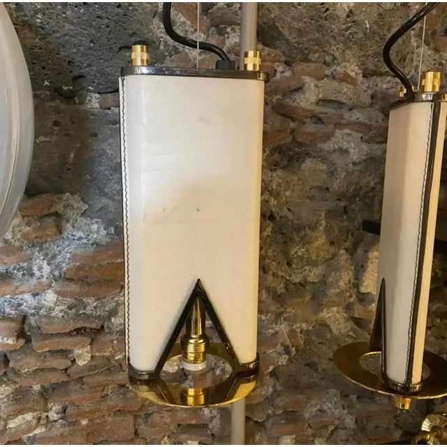 A double light pendant designed and manufactured in Italy in the Eighties. The white and black skin it's in very good...