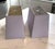 A perfect pair of medium gray rectangular sloping lampshades.