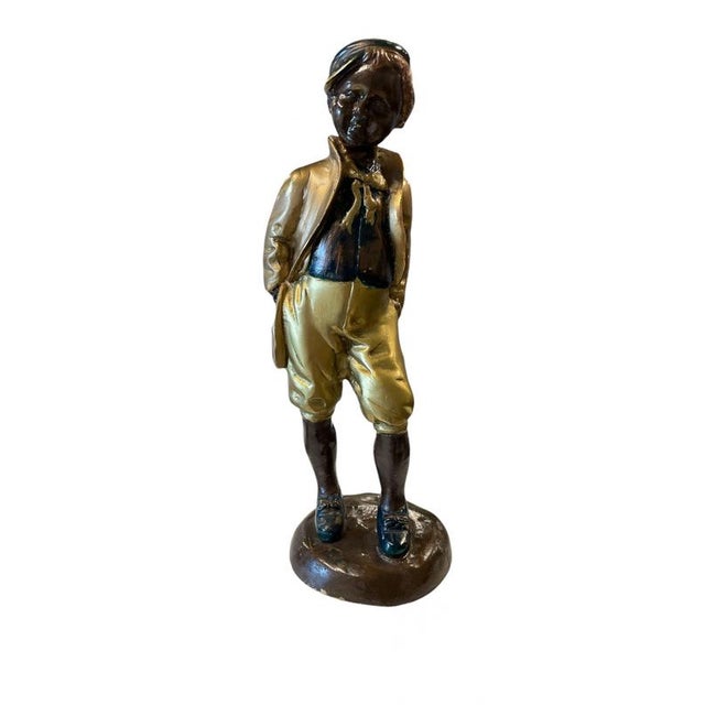 A Young Boy with Hat – Brass Figure, Early 20th. CenturyAn overpainted brass figure of a young boy wearing a hat. Height:...