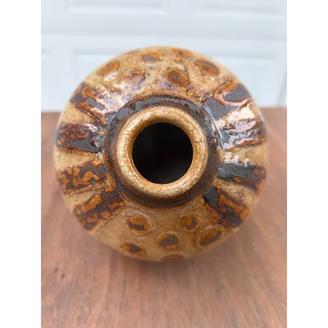 A very attractive handmade studio pottery weedpot. Decorative Spots alternate with stripes around the top portion of the...