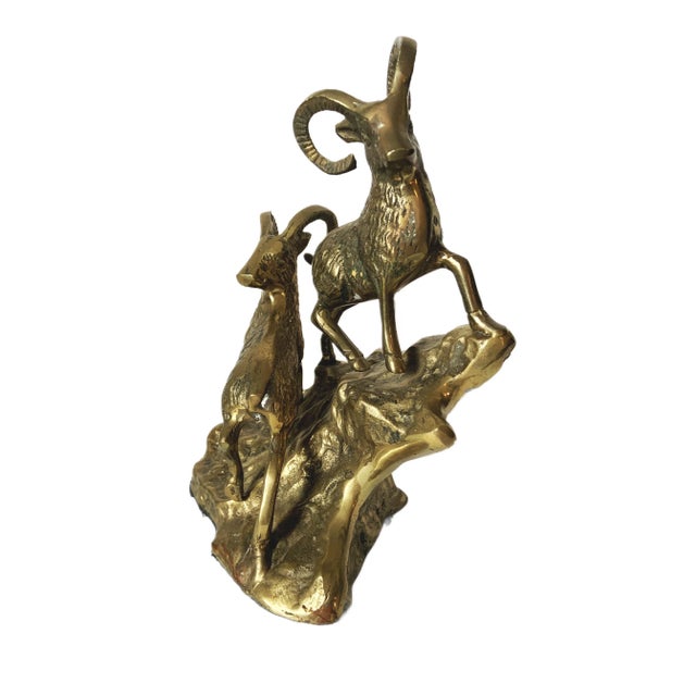 This vintage mid-century solid brass rams on hillside figurine is a captivating piece that embodies the bold and dynamic...