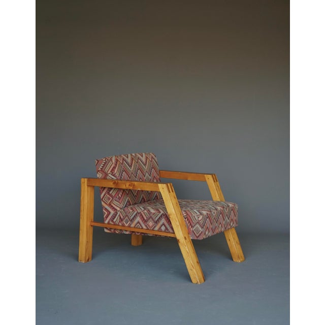 A stylish armchair or lounge chair in solid pine. In the style of Hein Stolle or Ate van Apeldoorn with nice visible...