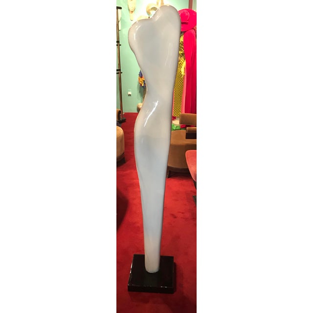 Tall sculpture of nude made of some type of composition it stands at 68” inches by 15” wide. In perfect condition.