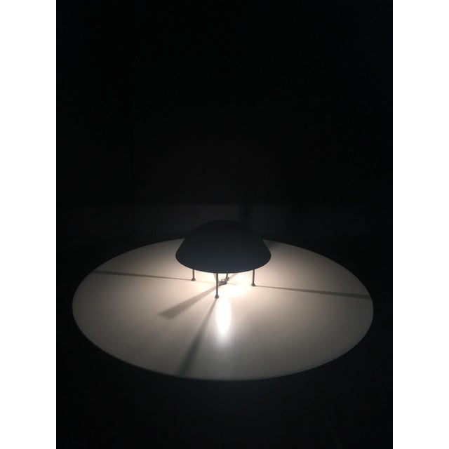 Beautiful iron floor lamp, probably from the Oluce company, Italian design from around 1980.The speciality of this floor...