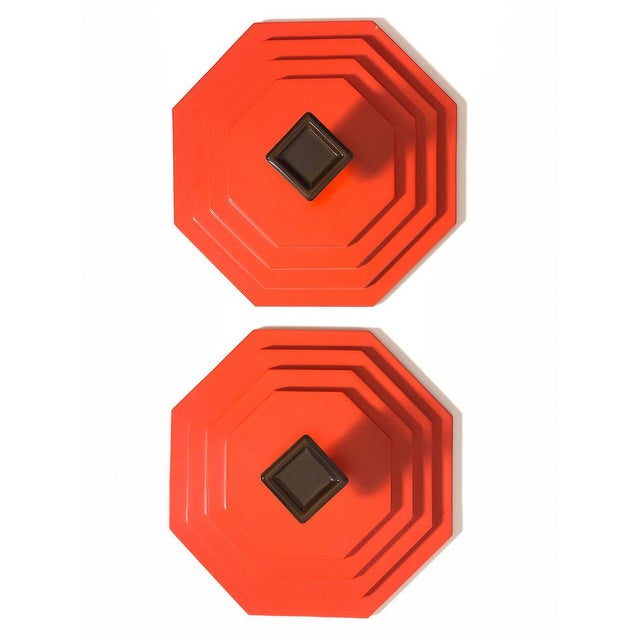 Gorgeous set of Orange coat hangers from the 1970s, with a geometric and futuristic design inspired by the Spage Age...