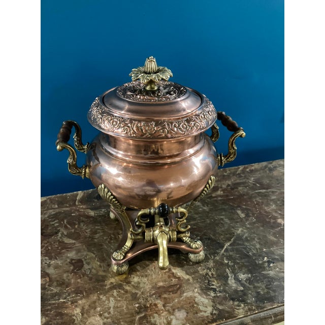 An elegant and authentic 19th-century copper and cast brass tea urn, beautifully crafted in a classic baluster form and...