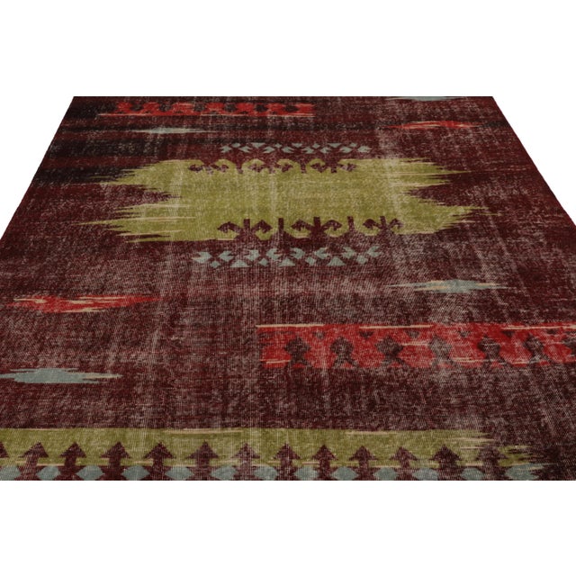 Hand-knotted in wool and originating from Turkey circa 1960 – 1970, this 7x10 vintage Zeki Müren rug is a unique addition...