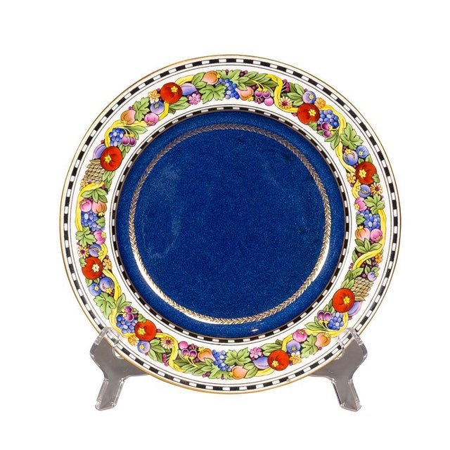 Retailed by Ovington Brothers. Circular with fruit and floral border and powder blue interior. Gold edge.