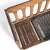 A compact mid-century bench with a warm wood frame, clean geometric supports, and a hand-woven black strap seat. The airy...