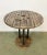 Vintage Industrial circle coffee table from the 1960s. It features black iron legs and a solid wooden surface with very...