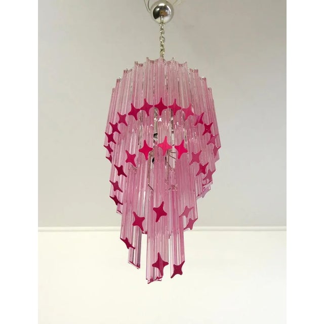 Fantastic Murano chandelier made by 54 Murano pink crystal prism (quadriedri) in a chrome metal frame. The shape of this...