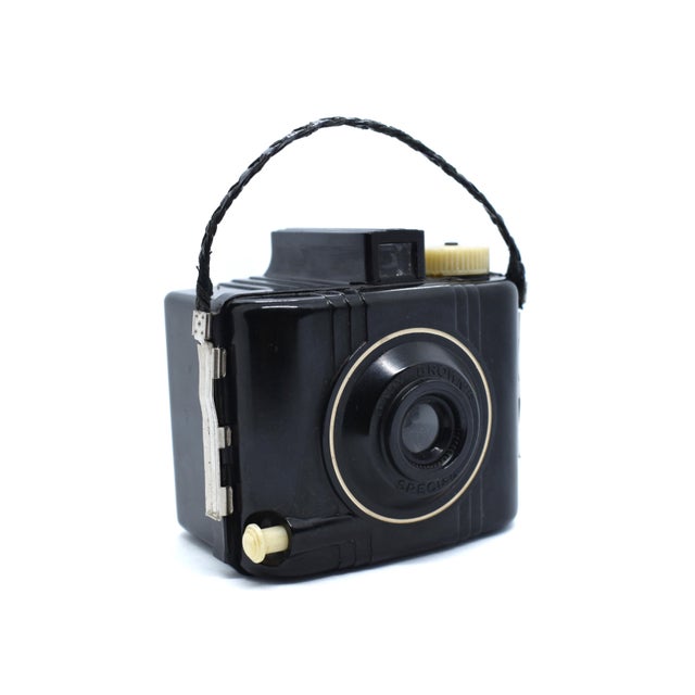 This charming Eastman Kodak Baby Brownie Special is a quintessential piece of mid-century photographic history,...