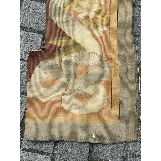 Very beautiful antique French Aubusson tapestry border fragment featuring flowers with nice natural colours in the hues of...