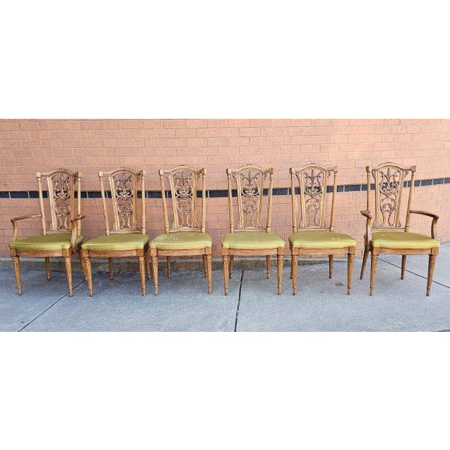 Set of six Louis XVI Style Brass Mounted French Walnut upholstered dining chairs. Four side chairs and two captain chairs....