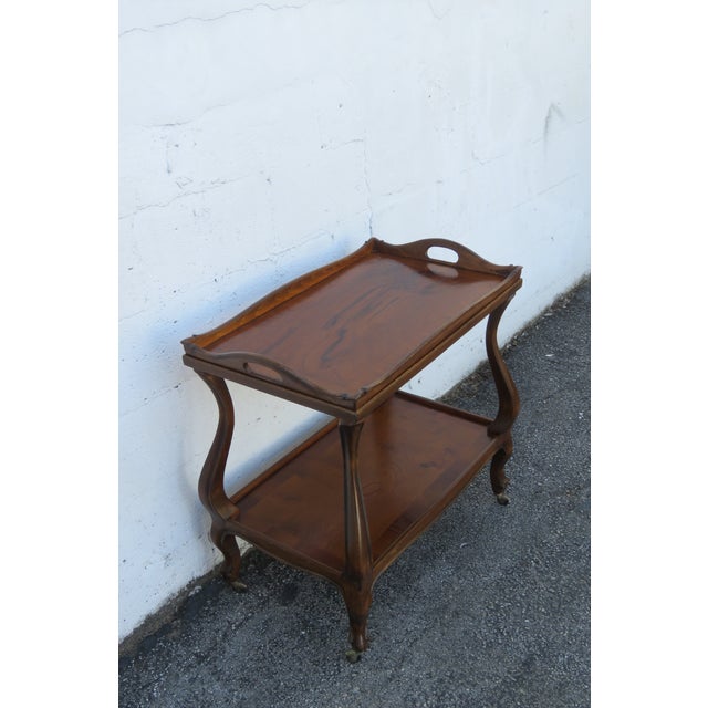 This classic Tea Cart is made of wood, solid wood, exotic wood, and veneer. The Cart has a Traditional style and design,...