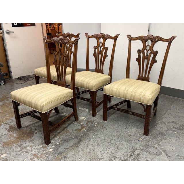 Design Plus Gallery presents a Set of Four Chippendale Style Dining Chair from Burton Ching. These chairs have a carved...