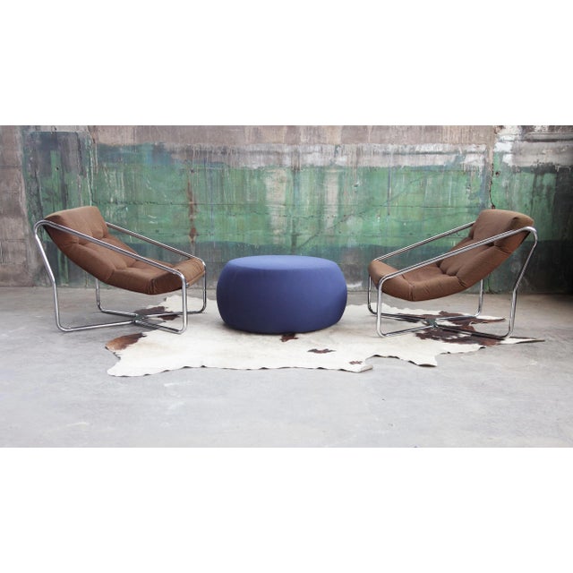 Two seat pouf. Upholstery in leather, faux leather, fabric or customer's own material. Fitted with glides. Gorgeous Mint...