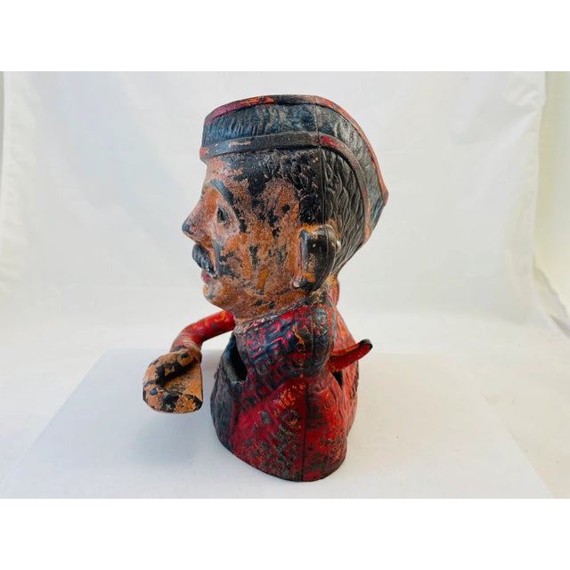 Offering a RARE c.1931 Kiltie Cast Iron Mechanical Bank - John Harper Ltd. Working Condition. This cast iron piece is in...