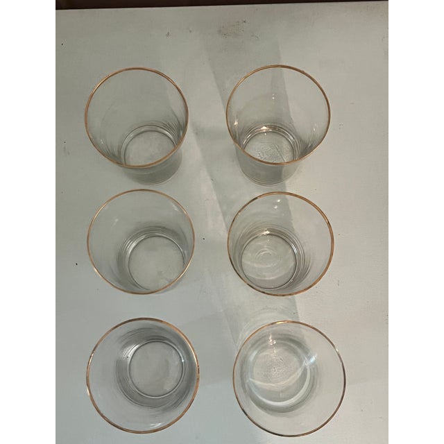 A charming set of six vintage tumblers, each hand/mouth-blown with the very slight variations in form and glass thickness...