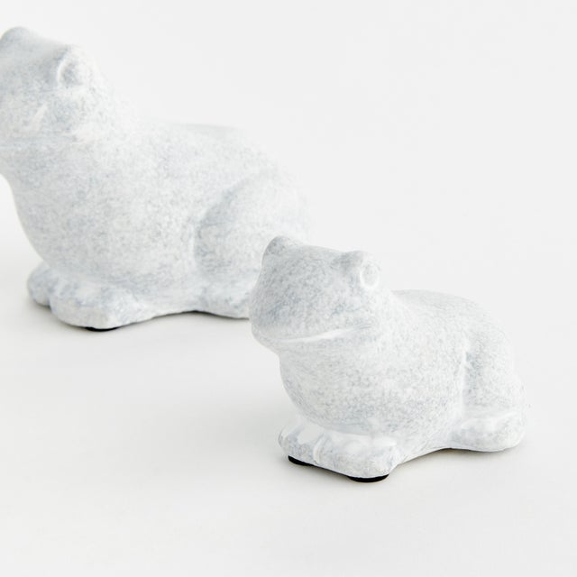 This sweet little duo of modern frog sculptures is made of concrete and finished in aWhitewash. A charming accent for the...