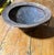 An exceptional antique-style primitive wooden bowl, beautifully hand-carved with a substantial circular form, deeply...