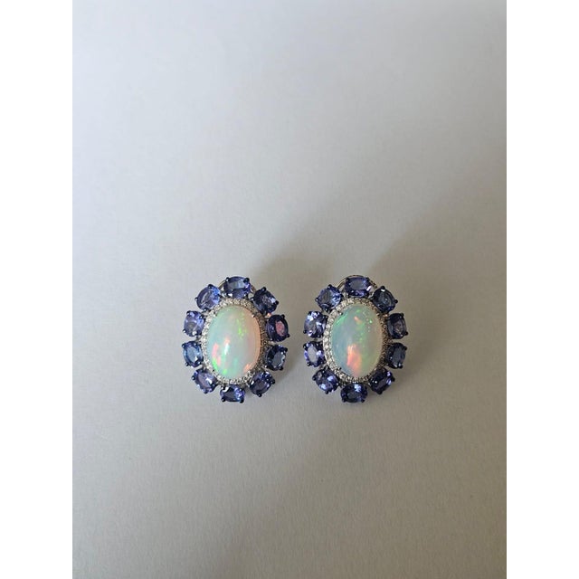 A very gorgeous and beautiful, modern style, Ethiopian Opal & Tanzanite Stud Earrings set in 18K White Gold & natural...