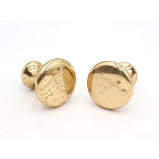 Vintage Classic style plain polished brass round cabinet or drawer knobs. Mounting screws are included. Good condition...