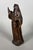 Saint Anne or Saint Bridget, carved wood with a brown patina. French work, 17th century. She is depicted with one hand...