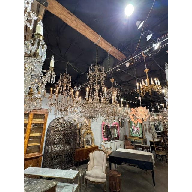 This late 19th century Swedish crystal and gilt brass chandelier is a stunning piece of home decor that adds a touch of...