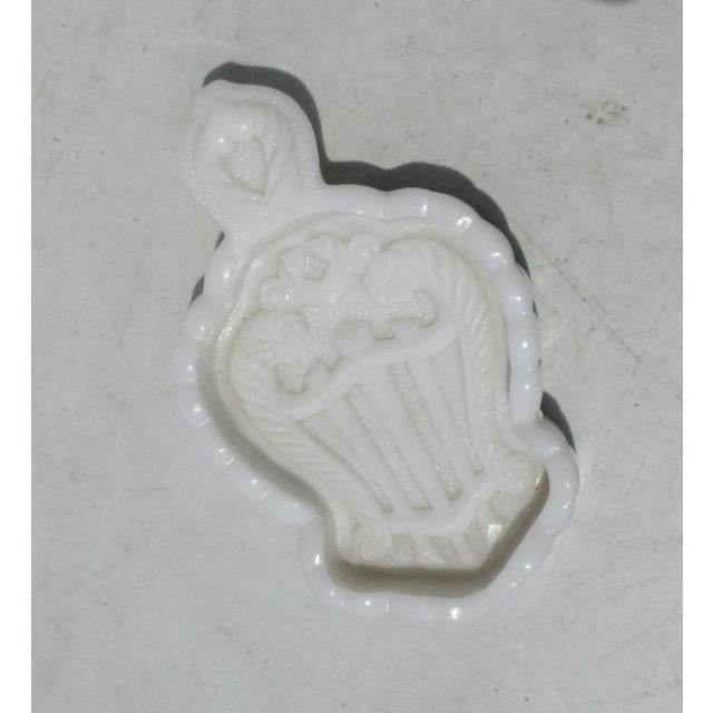 Milk glass pin tray for a vanity or make-up table. fine glass sculpted tray with a lyre design in raised form across the...