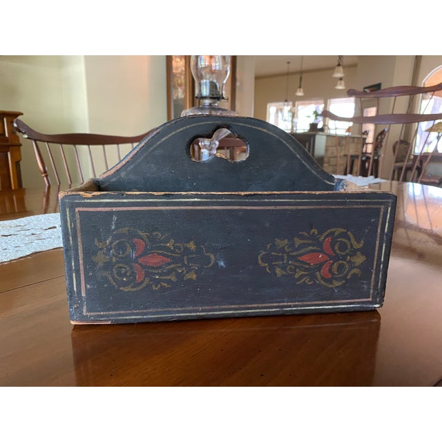 From Norway originally, very collectible, silverware tray. Decorated in beautiful Rosemalling, with red and gold on black...