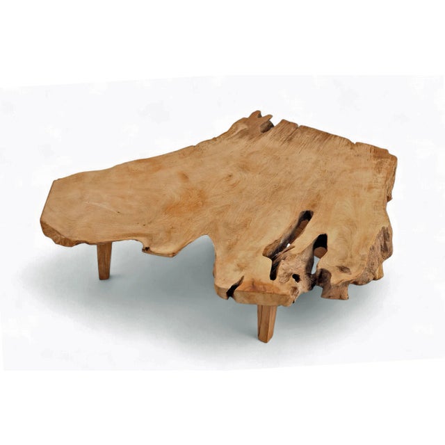 Inspired by the beauty of natural form, this organic coffee table is handcrafted from one single piece of reclaimed teak...