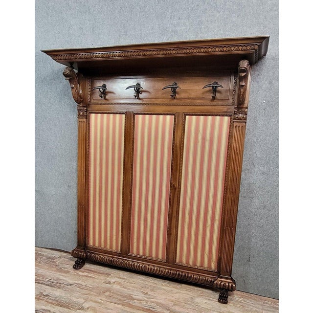 Large Renaissance-style walnut coat rack, circa 1850 4 hooks decorated with stylized dolphins against a tapestry...