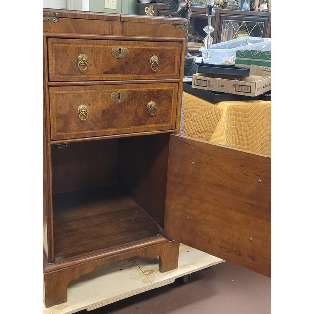 A fine vintage Baker Furniture from the Charleston collection Southern chest with fold-out top. Features two drawers over...