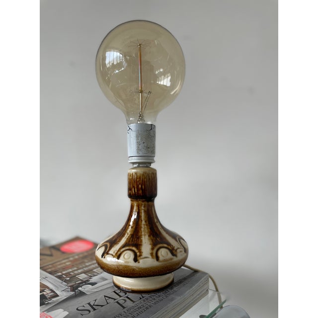 Stoneware table lamp produced by søholm on the island of bornholm, denmark, during the mid-20th century. the lamp features...