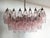 Elegant italian chandelier made from 56 beautiful murano pink glasses "poliedri". Structure in gold and brass colored...