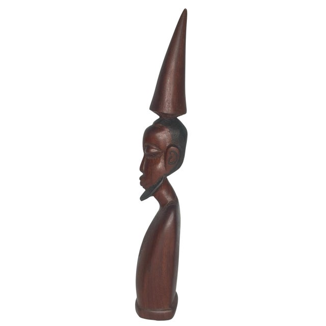 A finely carved standing figure in the Makonde tradition of Tanzania and Mozambique, one of East Africa's most celebrated...