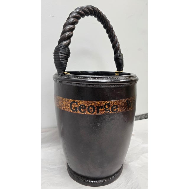 A Maitland Smith Leather Wrapped and Bartley Twisted Handle " George Washington " Pail Measures 10" in width, 10" in depth...
