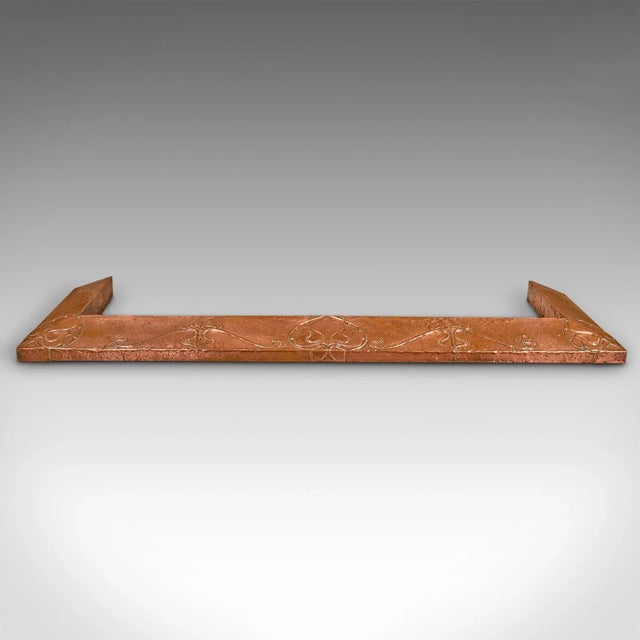 This is an antique decorative fire kerb. An English, copper fireside hearth surround in Art Nouveau taste, dating to the...