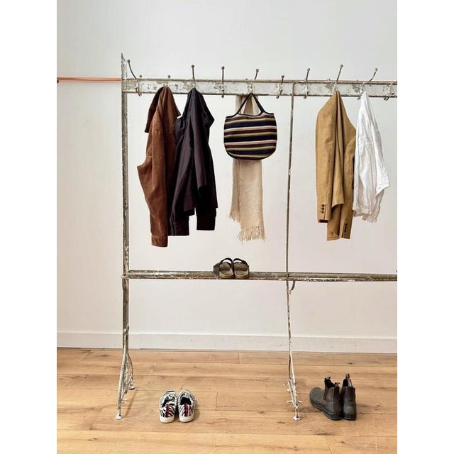A beautifully Victorian wrought iron coat stand in its original paint. Double sided hooks with lots of room to hang in...