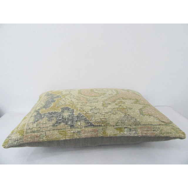 Decorative pillow cover made from a vintage Turkish handknotted rug. Backed with good quality cotton fabric. Pillow...