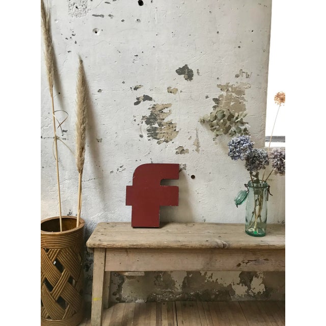 This old industrial letter F in metal was produced around 1950.