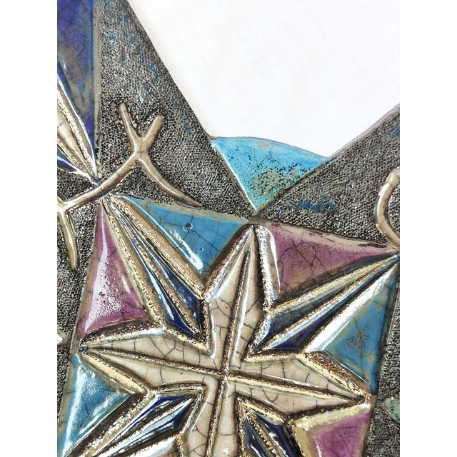 "Crossroads between the finite and the infinite" is a unique Raku ceramic work, entirely hand-molded and decorated by...