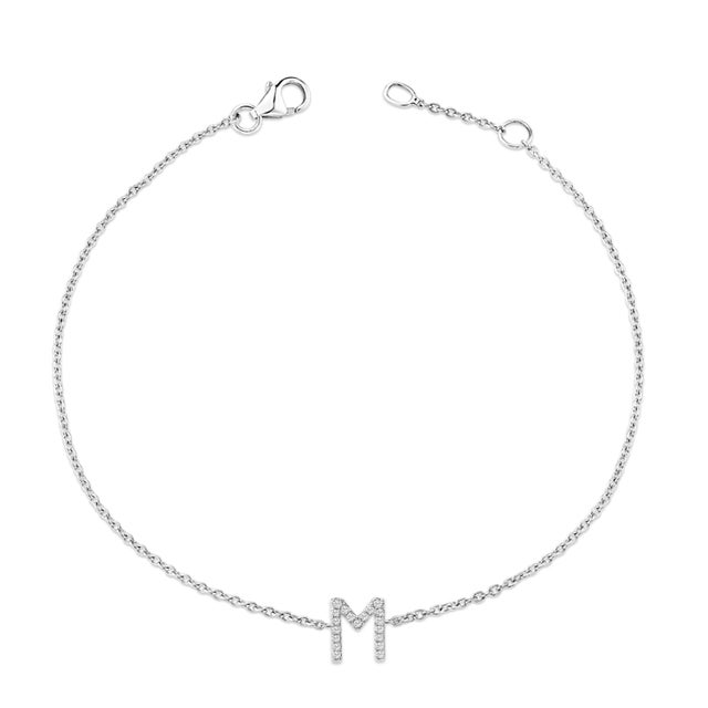Immerse yourself in the understated elegance of this 10K white gold bracelet, rhodium-plated for an enrapturing shimmer...