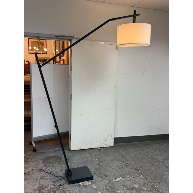 Design Plus Gallery presents a Clarkson Floor Lamp from Room & Board. The lamp pairs a long-arched steel arm with a...