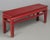 A 19th Century Chinese Qing dynasty red lacquered elm wood bench. Handcrafted using pegged and tenon construction with...