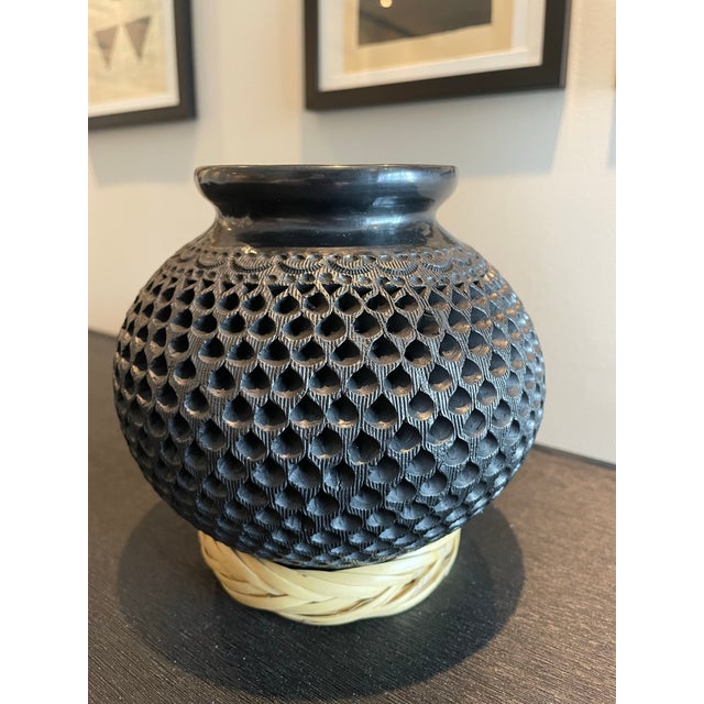A beautifully crafted black clay pottery vessel from Oaxaca. Unique to the region, the black clay in extracted from the...