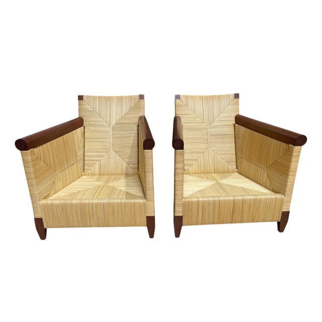 Classic chairs Attributed to Donghia, designed by John Hutton Solid wood frame with woven rattan exterior Each chair has a...